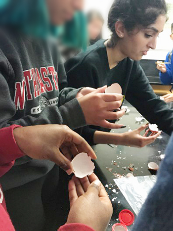 Members of Kapur's high school club do a science experiment making their own geode